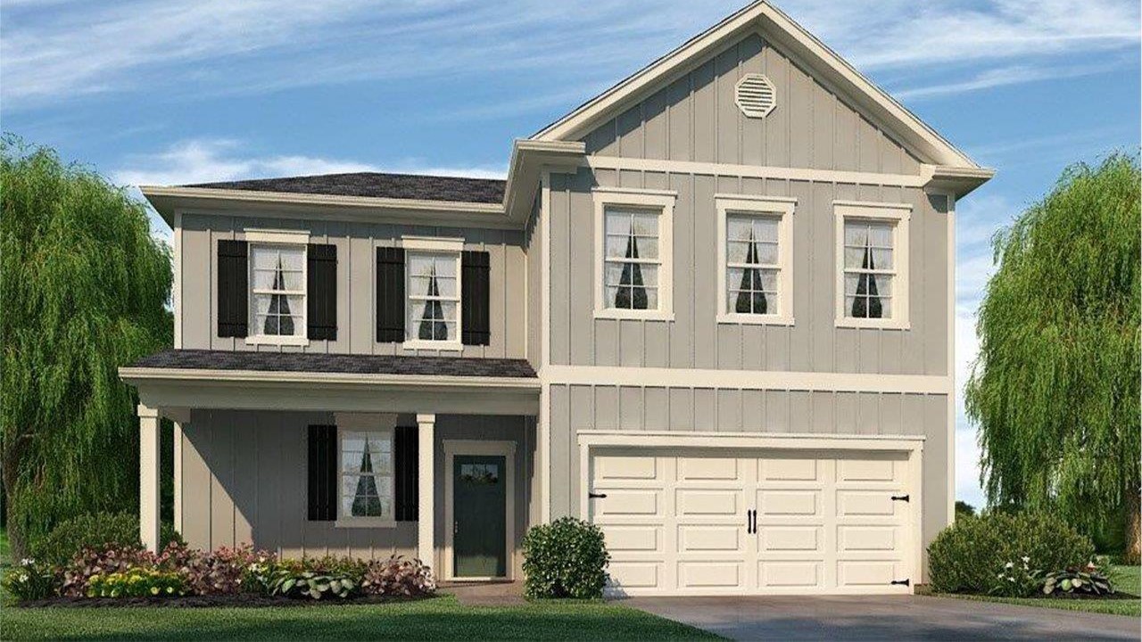 2 story home with a front porch and 2 car garage