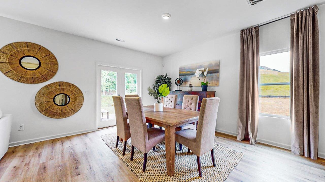 Formal dining room with a large dining table with 6 chairs