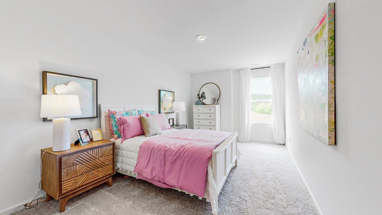 The third bedroom is also spacious and has ample room for a queen bed and two nightstands.