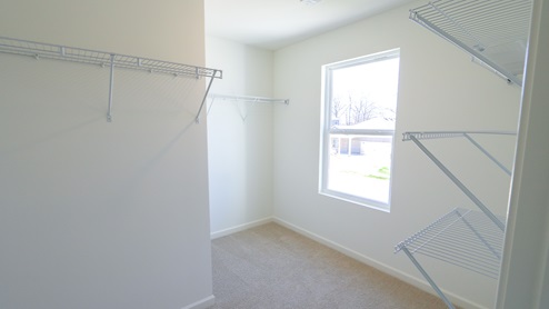 Another view of the walk in closet in the primary suite.