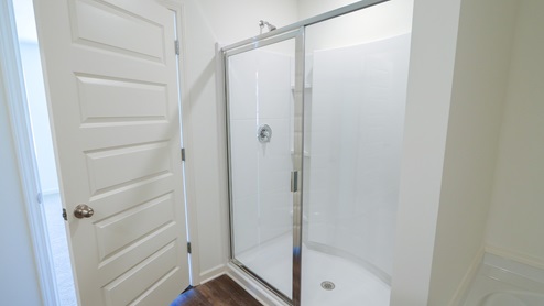 The stand up shower in the primary bathroom.