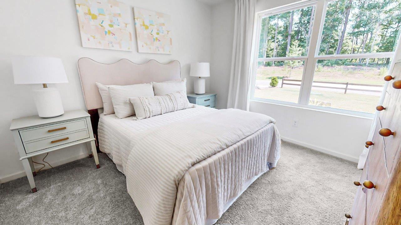 Cali – Bedroom 3 – the third bedroom is in the front of the house and features a bed with 2 nightstands and a dresser
