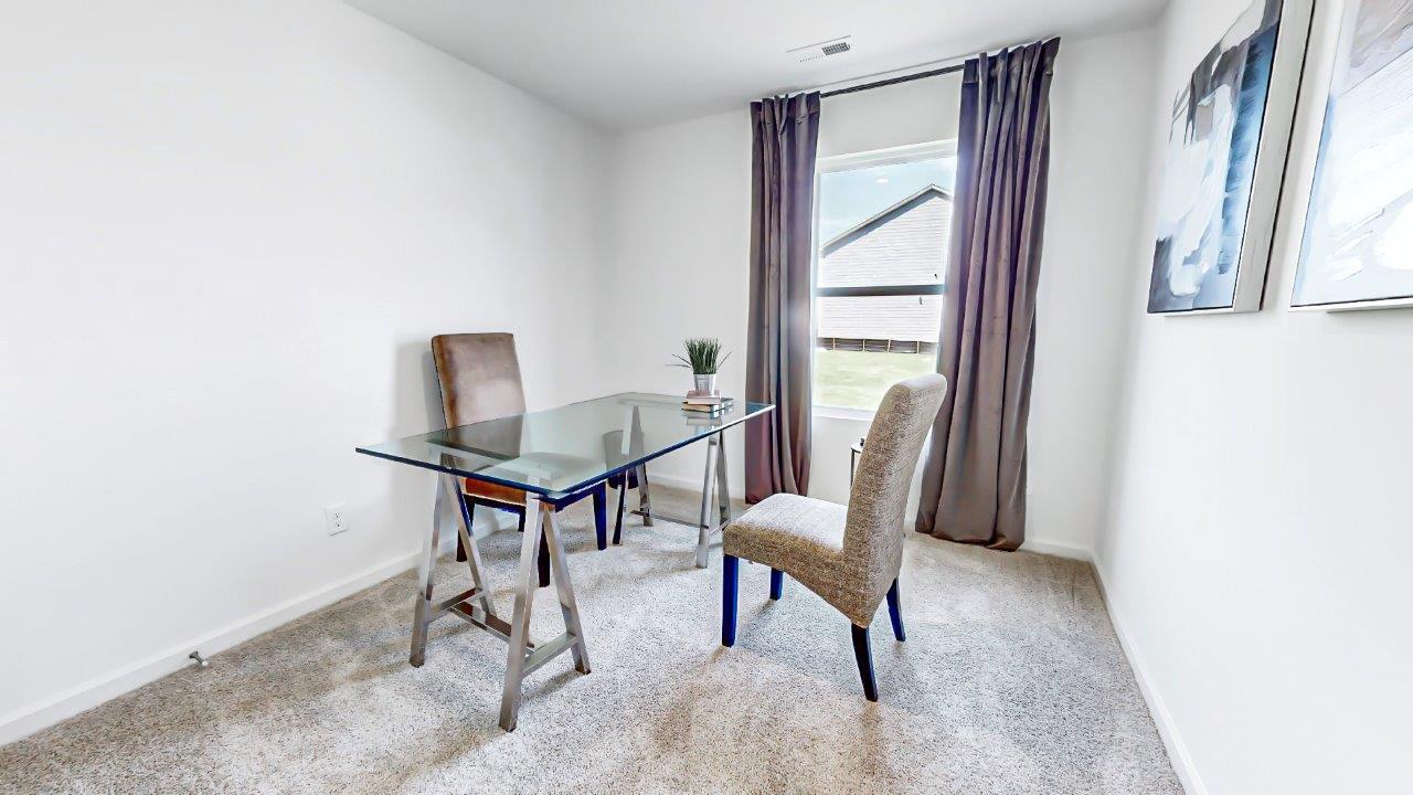 Freeport – Bedroom 4 – the fourth bedroom is currently being used as an office and contains a desk with a guest chair