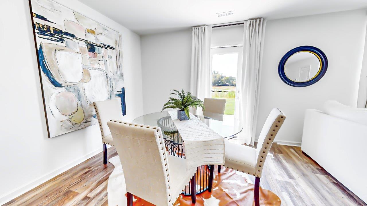 Dining area features a round table with four chairs