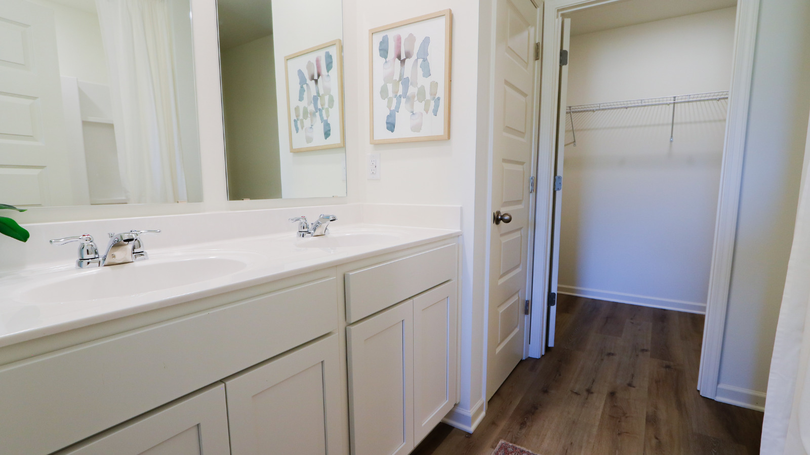 Express Package -   1expresskitchen: A modern kitchen featuring stainless steel appliances and elegant granite countertops.   2expresskitchen2: Another angle of the kitchen featuring stainless steel appliances, three bar stools at the island, and the entrance to the primary bedroom.   3HAYDENsink: A kitchen sink with a sleek faucet, set against speckled granite countertops on a stylish kitchen island.   4expressbathroom2: A bathroom view from the door featuring white cabinets, a double vanity, a shower on the right, and a toilet in the center.      5express photo: Image took from straight on with a view of the double vanities and a bathroom closet on the left.    6ExpressBathroom: A spacious bathroom featuring a double sink, shower, walk-in closet, and decorative wire shelves.    7Solarboard: A close-up image of solar board   8solarboard2: A view from the inside of the trusses and solar board.