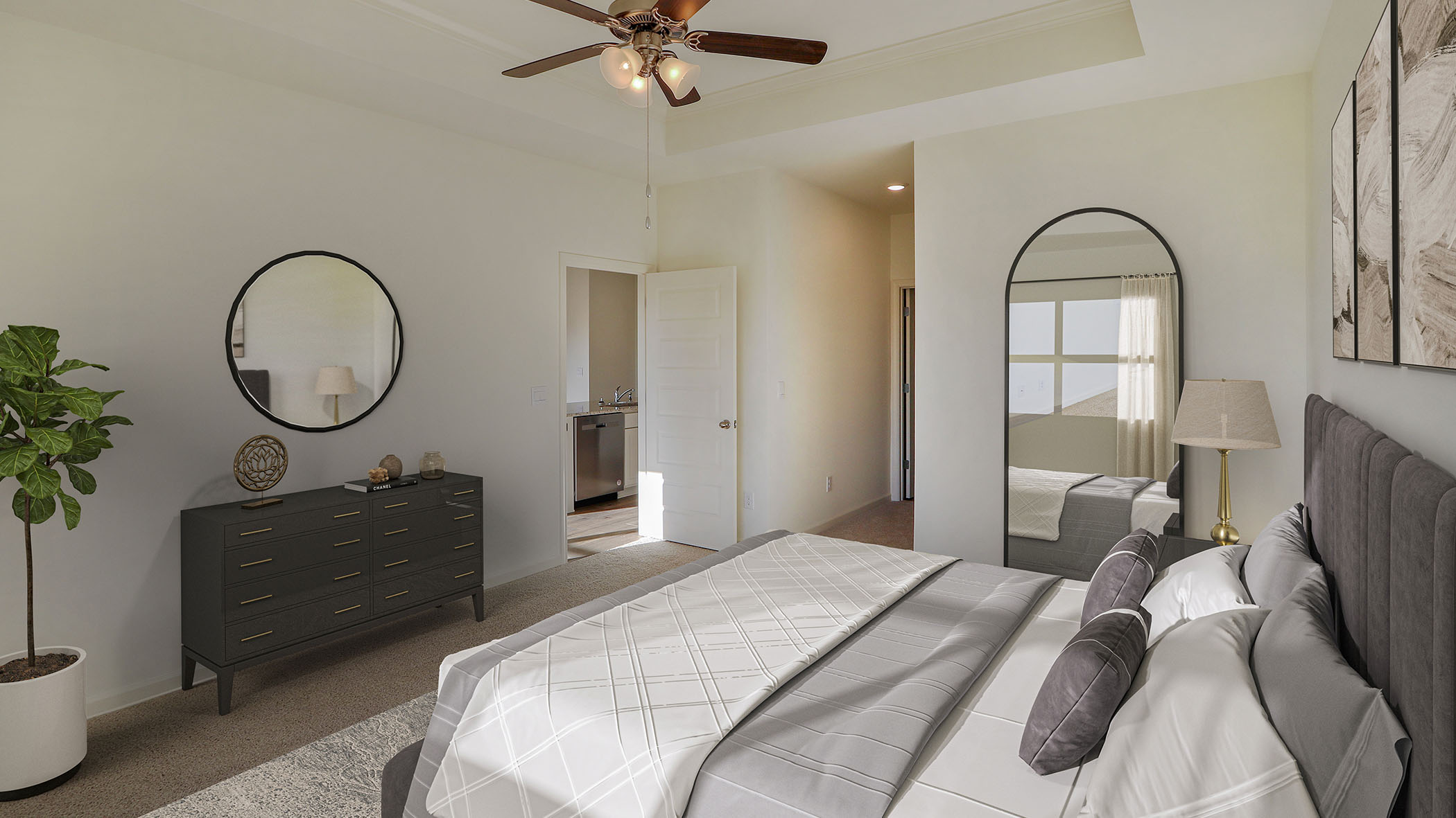 A cozy bedroom featuring a ceiling fan above a neatly made bed, creating a comfortable and inviting atmosphere.