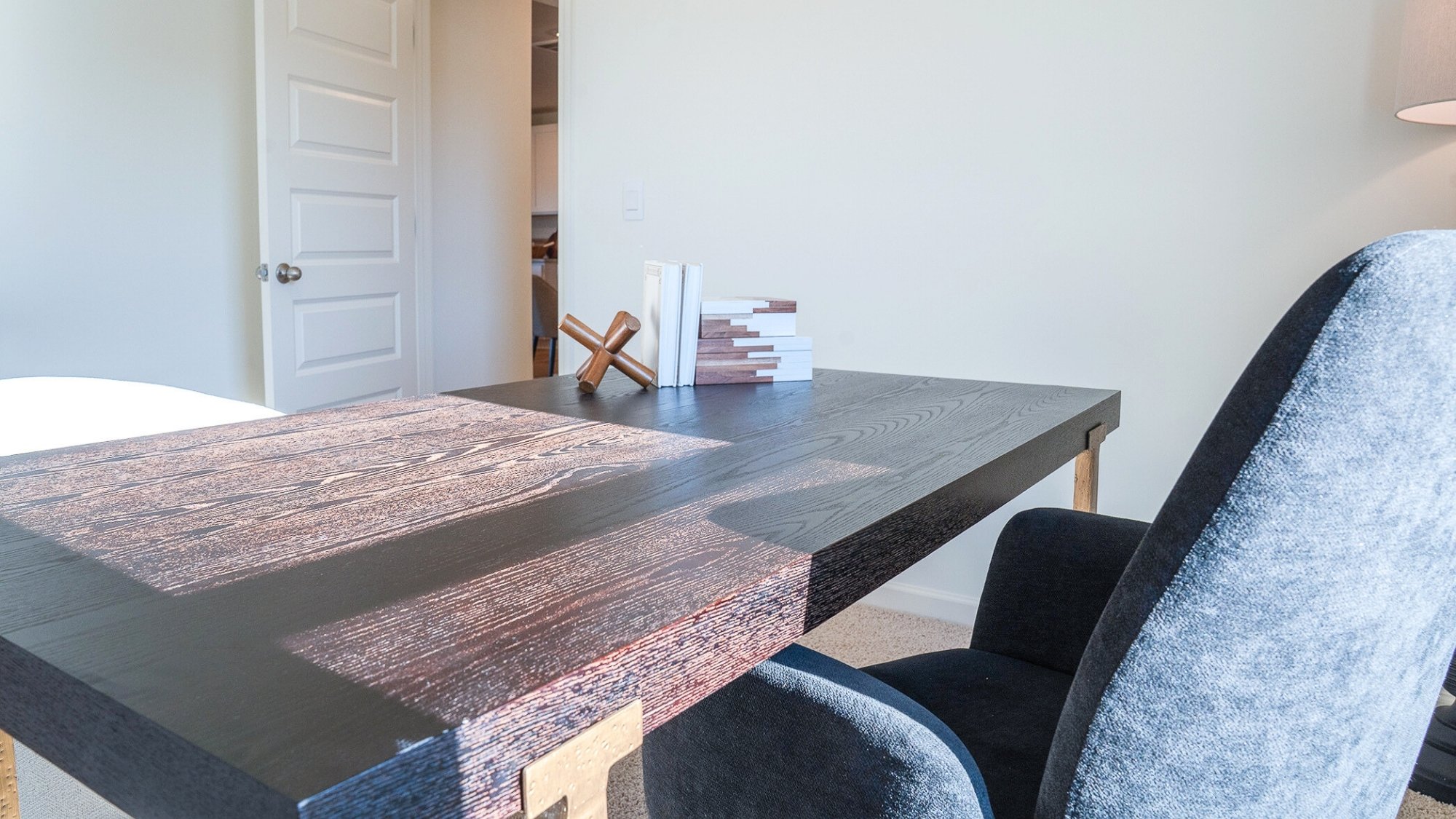 The fifth bedroom is shown here staged as a home office, with ample room for a large desk and 2 meeting chairs.