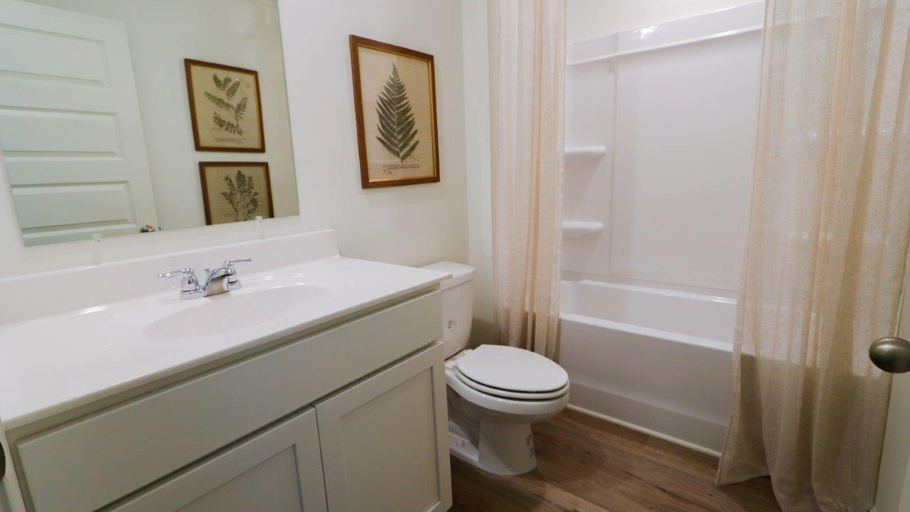 The Lakeside floor plan presents an exquisite 5-bedroom, 3-bathroom residence. The kitchen boasts a stunning design featuring quartz countertops, an undermount sink, a spacious island bar, top-of-the-line stainless-steel appliances, and a convenient corner pantry. Seamlessly connected to the family room, this kitchen is ideal for hosting gatherings and enjoying quality time with loved ones. Adjacent to the kitchen, you'll find a delightful breakfast nook and a separate dining area. The home is bathed in abundant natural light, creating a serene and inviting atmosphere. Step outside onto the expansive porch that leads to the backyard, further enhancing the relaxing ambiance. Bedroom 1 offers ample space and is accompanied by an adjoining bath that showcases a double vanity, a generous shower, and a walk-in closet. The home is crafted with superior materials and workmanship, showcasing meticulous attention to detail, and is backed by a one-year builder's warranty. Additionally, your new home includes our cutting-edge smart home technology package! A D.R. Horton Smart Home is equipped with an array of advanced features, including a Honeywell Z-Wave programmable thermostat, a Kwikset Z-Wave door lock, an Eaton Corporation Z-Wave wireless switch, a Qolsys, Inc. touchscreen Smart Home control device, an Alarm.com automation platform, a SkyBell video doorbell, and an Amazon Echo Dot.* For more information, please consult a New Home Sales Agent.