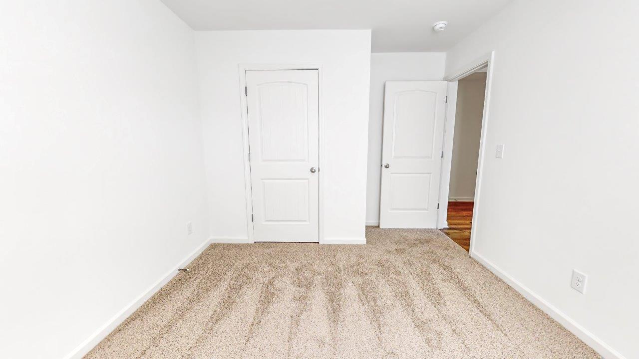 Lakeside – Bedroom 2 – second bedroom with closet and carpet