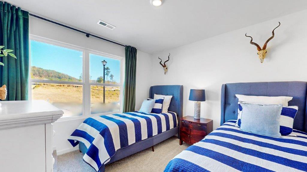 10. Cali – Primary bathroom – 1 – the large walk in primary bathroom features a double vanity with 2 sinks, and a walk in shower