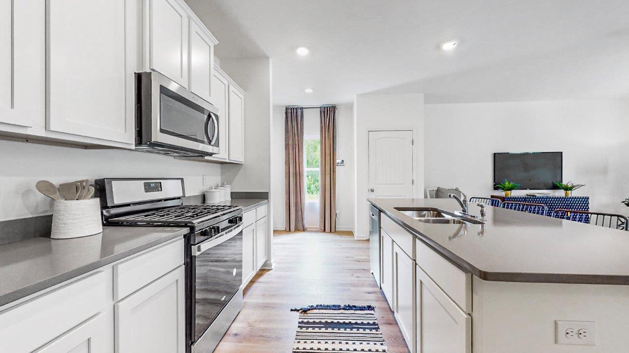 Elston – Kitchen – 2 – another view of the kitchen that shows the stainless steel appliances, and the walk in pantry