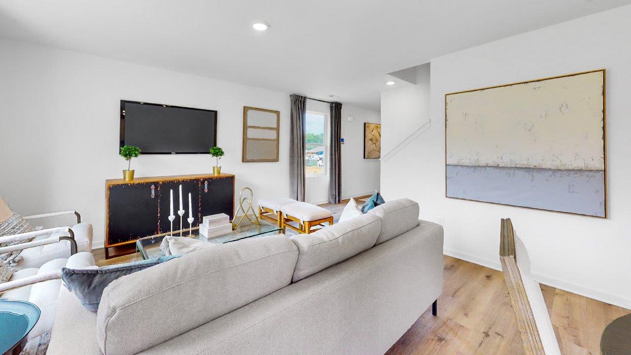 Taylor – Dining Area – Open to the kitchen the dining area features a round table with 4 chairs, and a door to the outdoor patio.