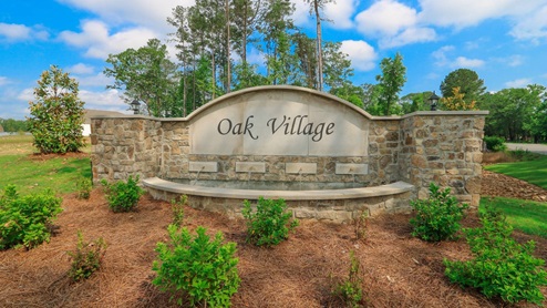 Another view of the entrance sign to Oak Village.