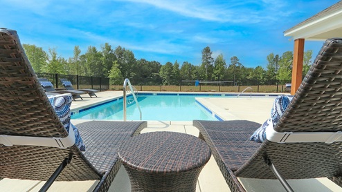 The Oak Village community pool features lots of room to lounge and swim.