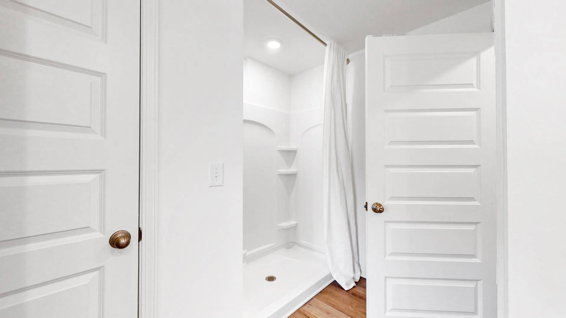 Enjoy a walk-in shower complete with a convenient linen closet.