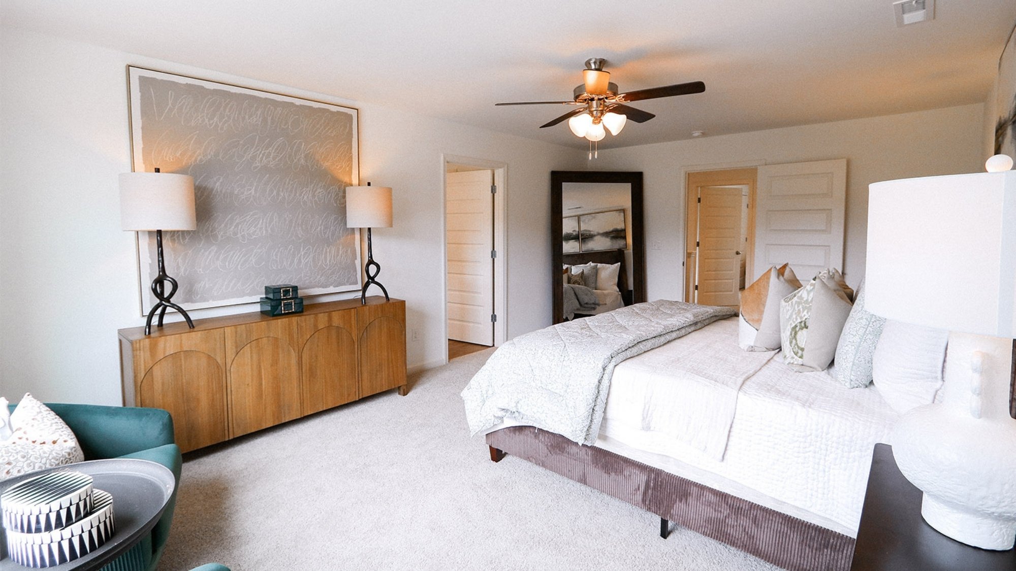 The spacious primary bathroom features a double vanity, providing ample space for two individuals to use simultaneously. It also includes a luxurious walk-in shower, offering a modern and convenient bathing experience. Additionally, there is a large garden tub, perfect for relaxing and unwinding after a long day.