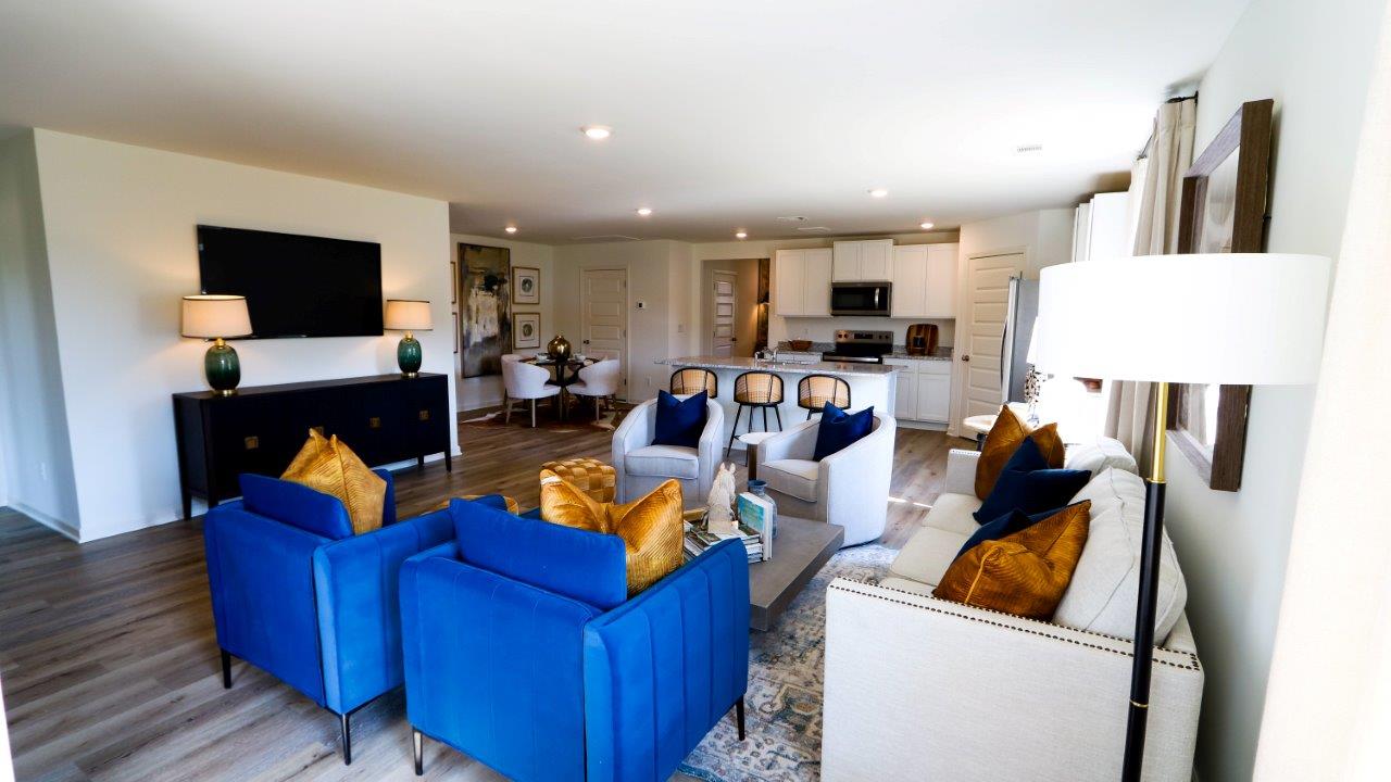 The Riverside floor plan features a luxurious 5-bedroom, 3-bathroom residence with a two-car garage and exquisite details. The kitchen showcases a stunning design with granite countertops, an undermount sink, a spacious island bar, top-of-the-line stainless-steel appliances, and a convenient corner pantry. This kitchen is seamlessly connected to the family room, making it perfect for hosting gatherings and spending quality time with loved ones.