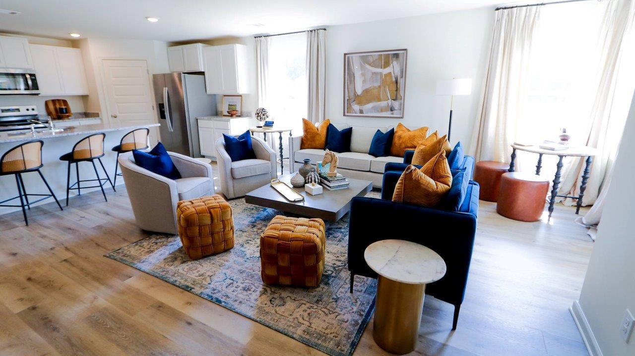 The Riverside floor plan features a luxurious 5-bedroom, 3-bathroom residence with a two-car garage and exquisite details. The kitchen showcases a stunning design with granite countertops, an undermount sink, a spacious island bar, top-of-the-line stainless-steel appliances, and a convenient corner pantry. This kitchen is seamlessly connected to the family room, making it perfect for hosting gatherings and spending quality time with loved ones.