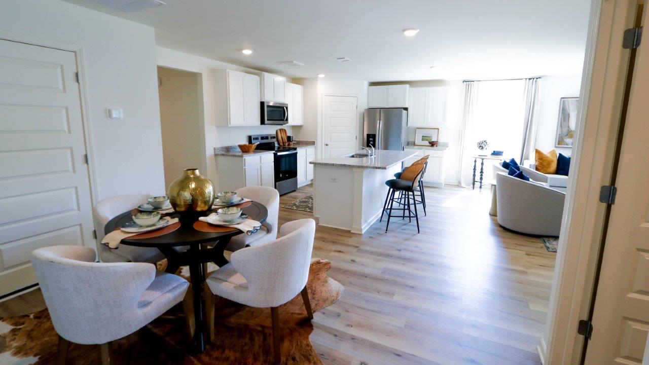 The Riverside floor plan features a luxurious 5-bedroom, 3-bathroom residence with a two-car garage and exquisite details. The kitchen showcases a stunning design with granite countertops, an undermount sink, a spacious island bar, top-of-the-line stainless-steel appliances, and a convenient corner pantry. This kitchen is seamlessly connected to the family room, making it perfect for hosting gatherings and spending quality time with loved ones.