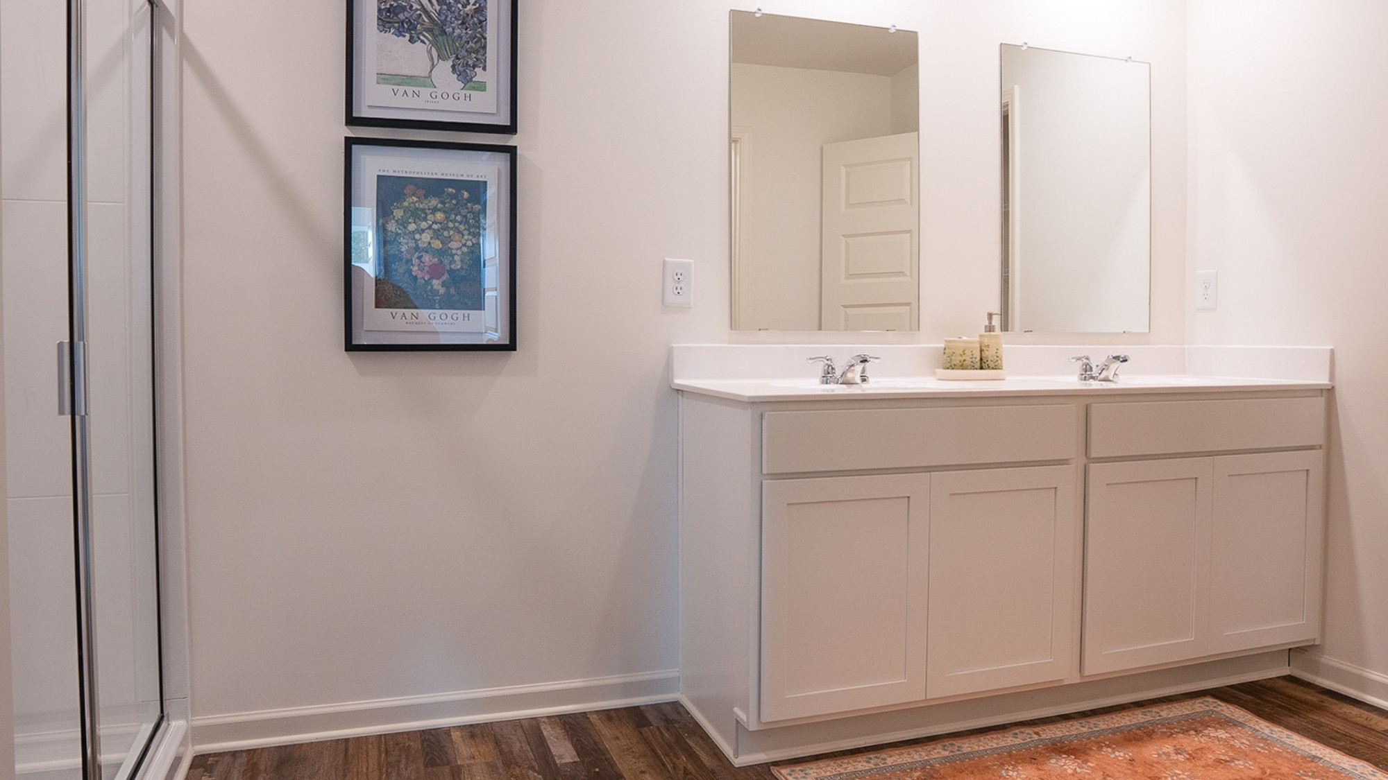 The roomy modern kitchen features stainless applianes and an island eating area large enough for 4 barstools.