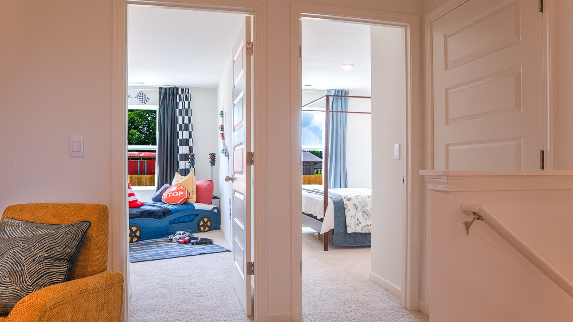 The primary bathroom features a toilet enclosure and a spacious double vanity.