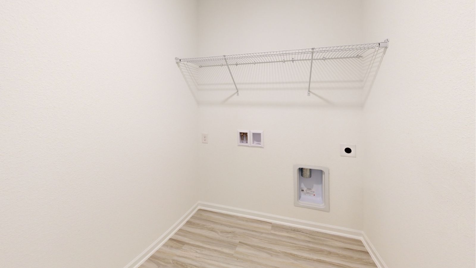 The Alston plan is a brand new single-level layout with 3 bedrooms, 2 bathrooms, and offers 1,734 square feet of living space. One standout feature of the Rhett plan is the seamless integration of the kitchen, breakfast area, and a dining area open concept layout, with direct access to a covered porch area. The kitchen is equipped with granite countertops, stainless steel appliances, and a pantry for added convenience and modern style. The Alston offers some luxurious convenience while priced for our express style plans.   The living area offers the wide open style that leads to a shaded covered patio, creating a welcoming space for relaxation and entertaining. Bedroom One suite offers a large walk in closet area, a gorgeous double vanity, and convenient access to the living area for added comfort and luxury. For convenience and storage, the plan includes a two-car garage and a laundry room. In addition to Bedroom One suite, there are 2 other bedrooms and another full bathroom, providing ample space for family and guests. Furthermore, the home comes with a one-year builder's warranty, ensuring peace of mind for the new homeowners.   Furthermore, every home is accompanied by a one-year builder's warranty to provide you with added peace of mind. It's important to note that our smart home technology package is included as part of your new home. The Smart Home Technology Package we offer is designed for effortless use and provides unmatched convenience, allowing you to easily control various essential features with just a simple touch. Some of the features of this package include lighting automation, an IQ panel, a video doorbell, keyless front door entry, and the ability to manage the temperature from the comfort of your phone. Give us a call and schedule your personal guided tour of the Alston today!