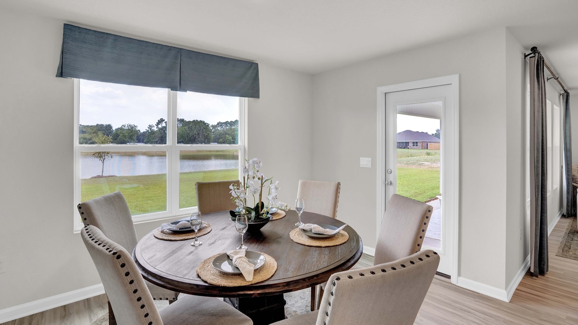 The dining area is spacious enough for a number of different sizes of dining tables. Shown here is a setup fit for 6.