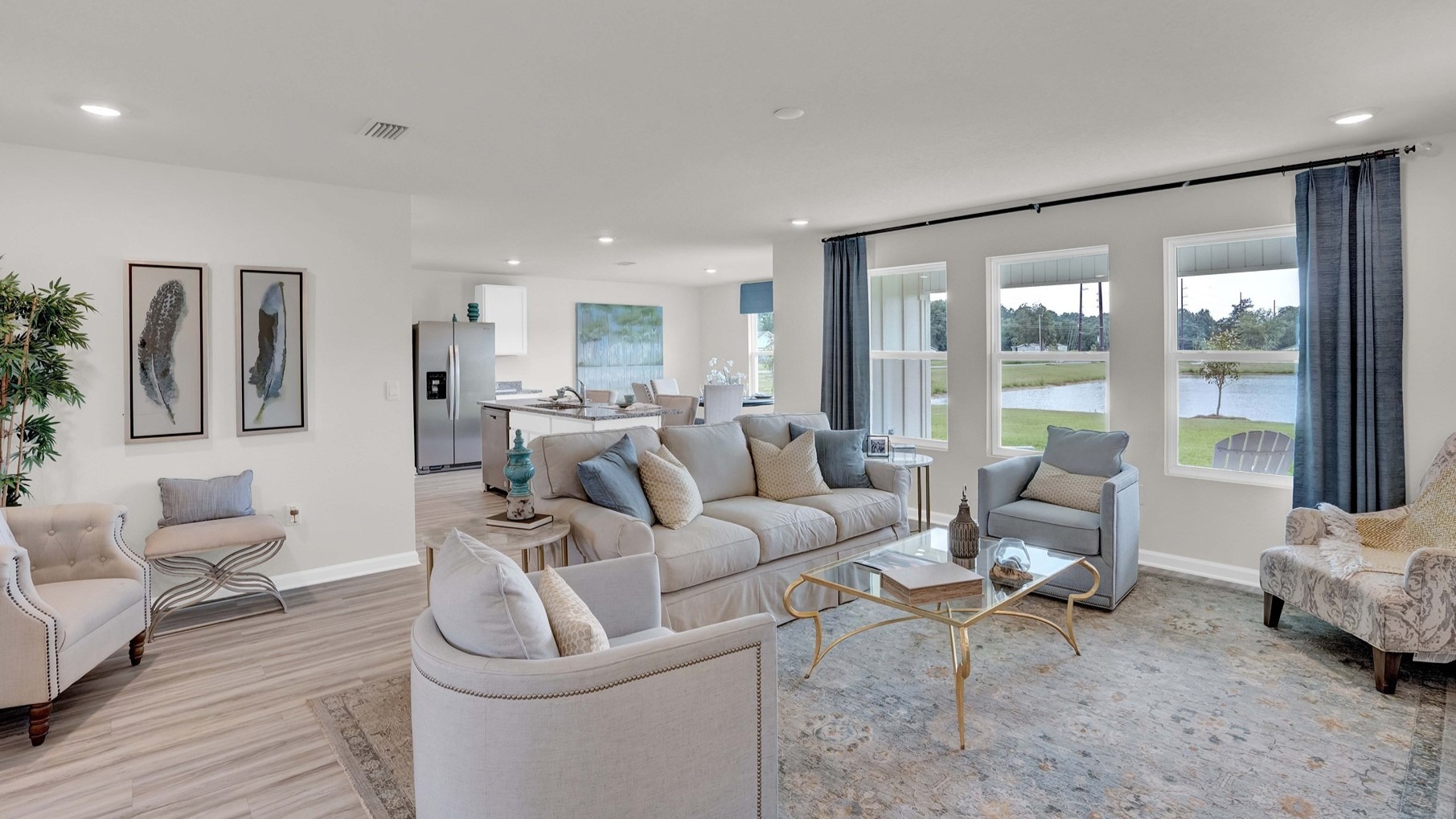 The dining room, kitchen, and living room all boast an open space with ample natural light.