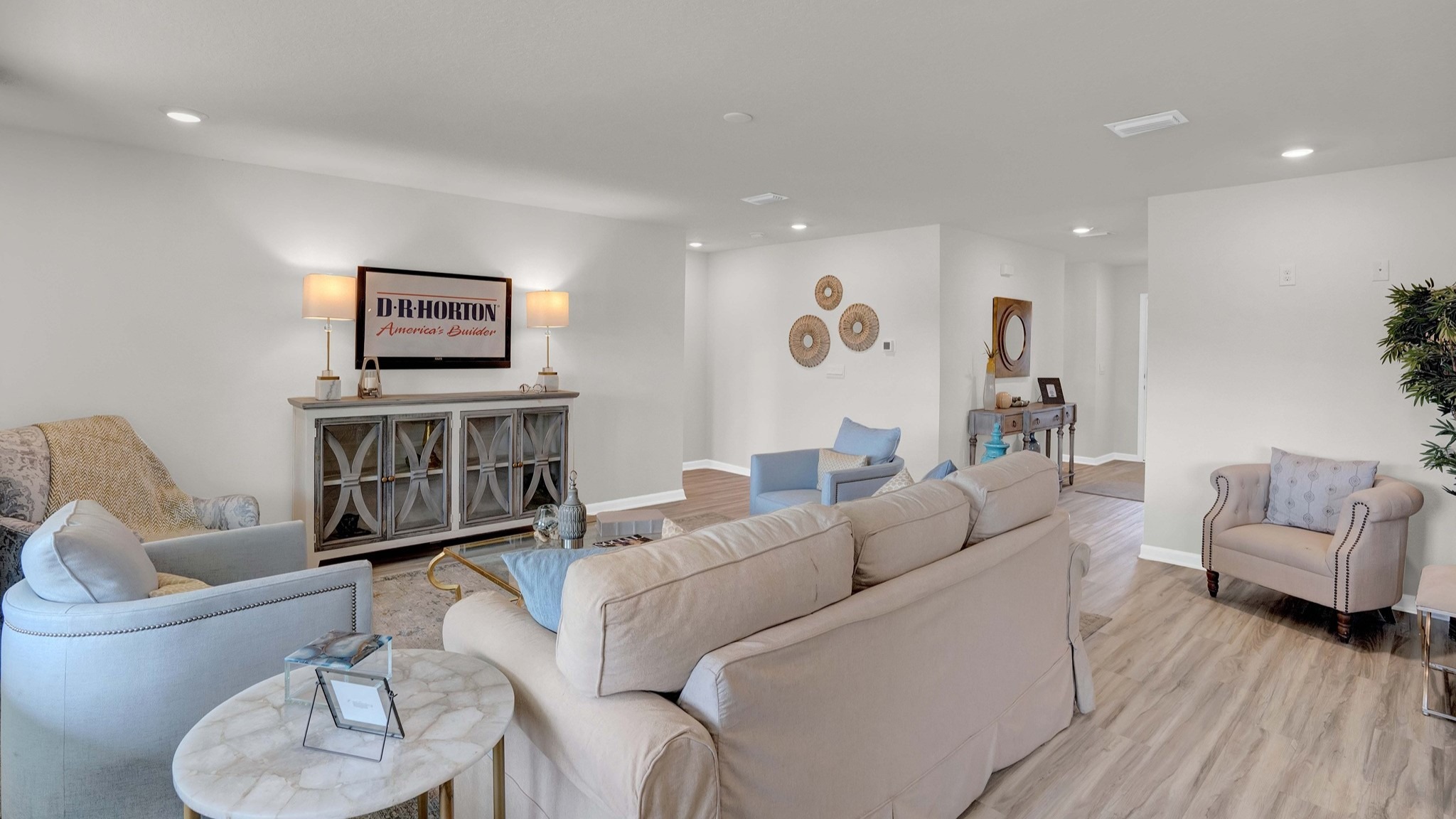 The large living room has space for basically any size couch, a large coffee table, and two large armchairs.