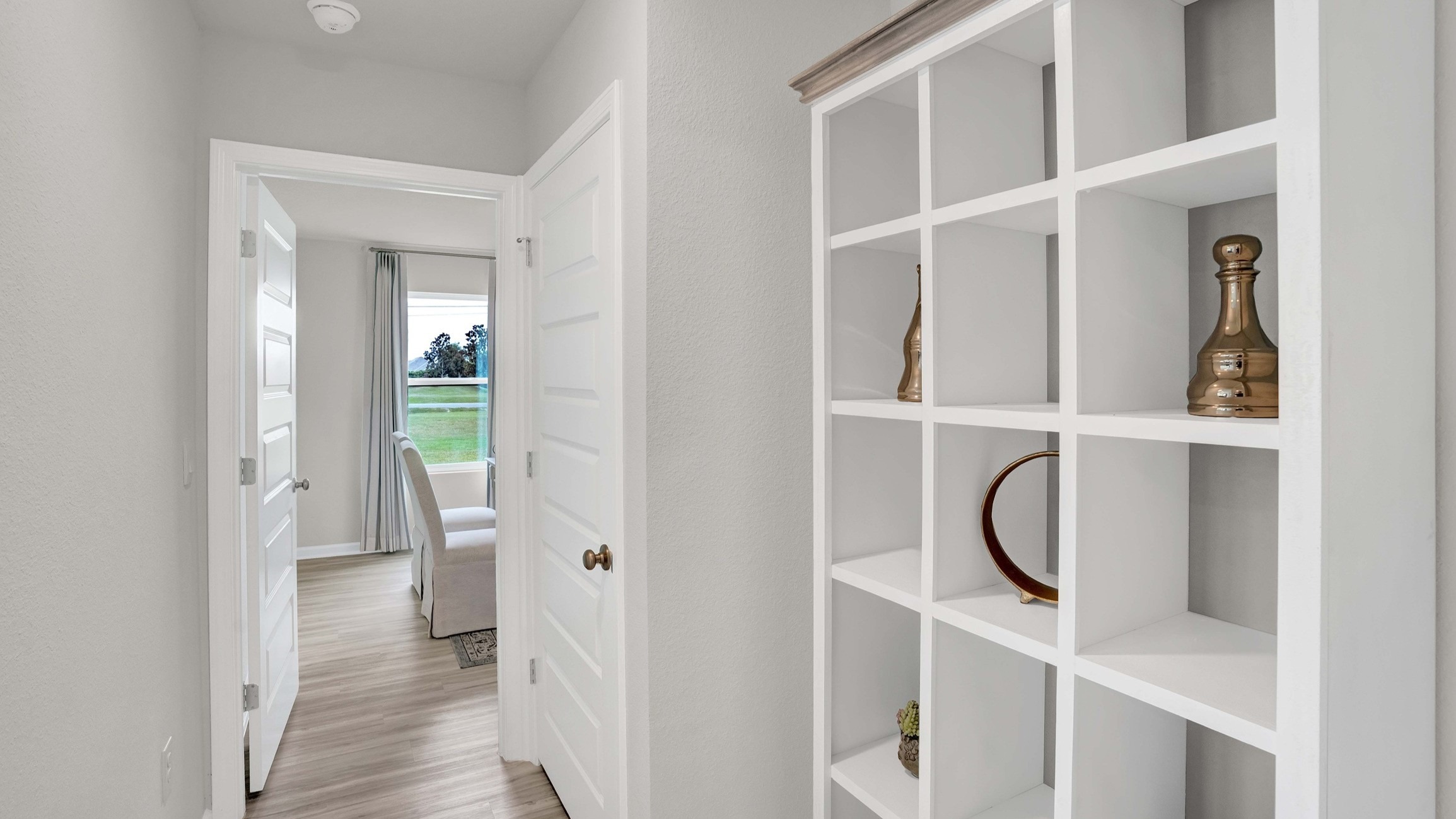 The hallways connecting the main areas to the bedrooms.