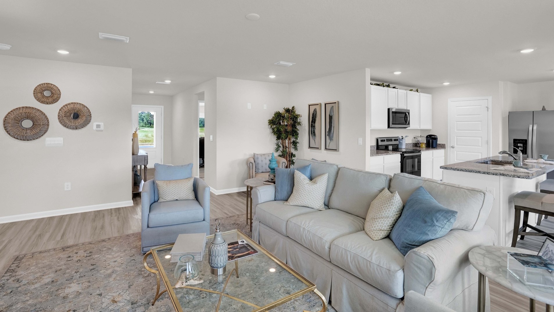 The kitchen area blends seamlessly into the living and dining areas, allowing for the whole family to spend time together.