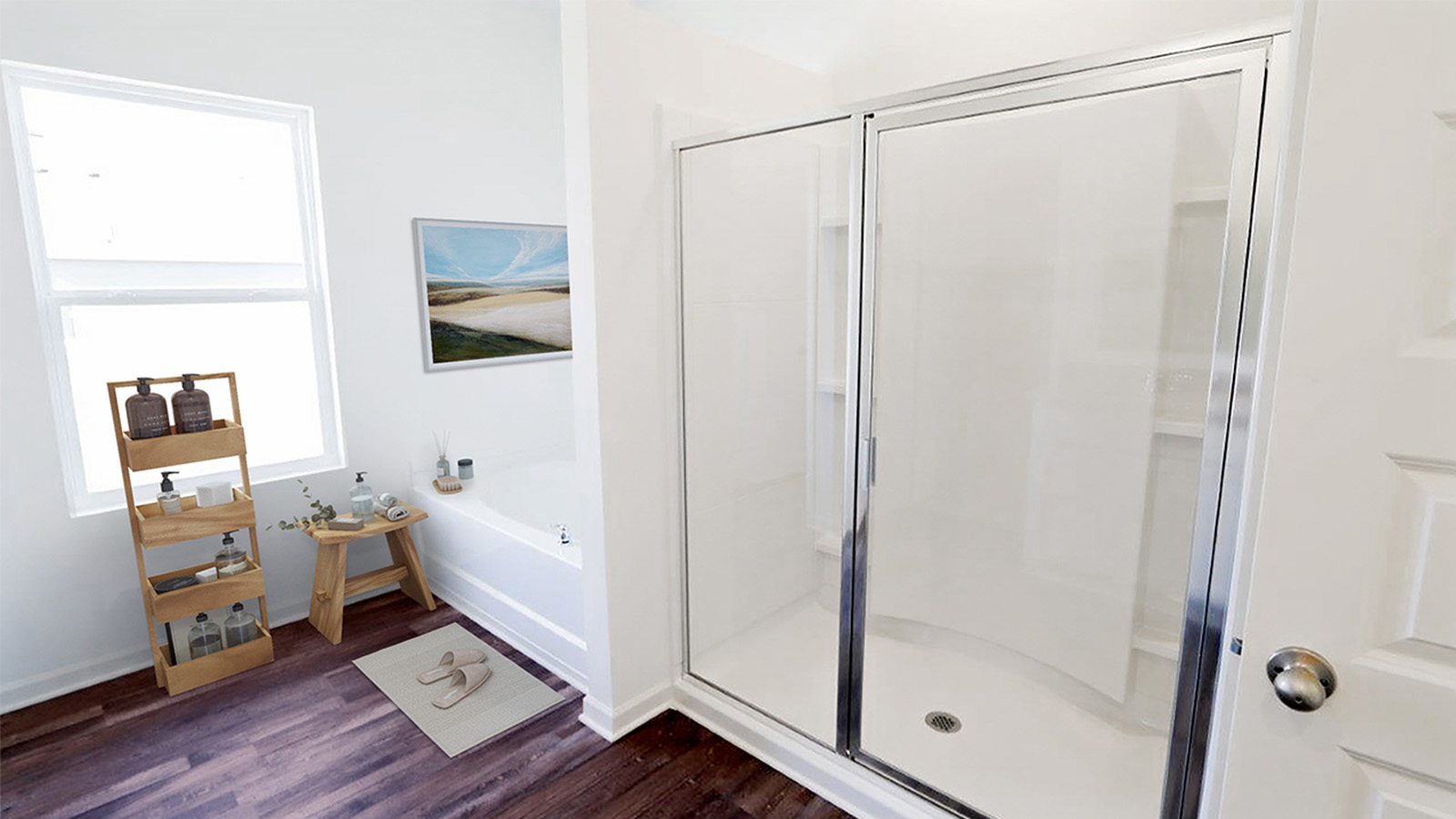 The primary bathroom has a spcaious shower and a large garden tub.
