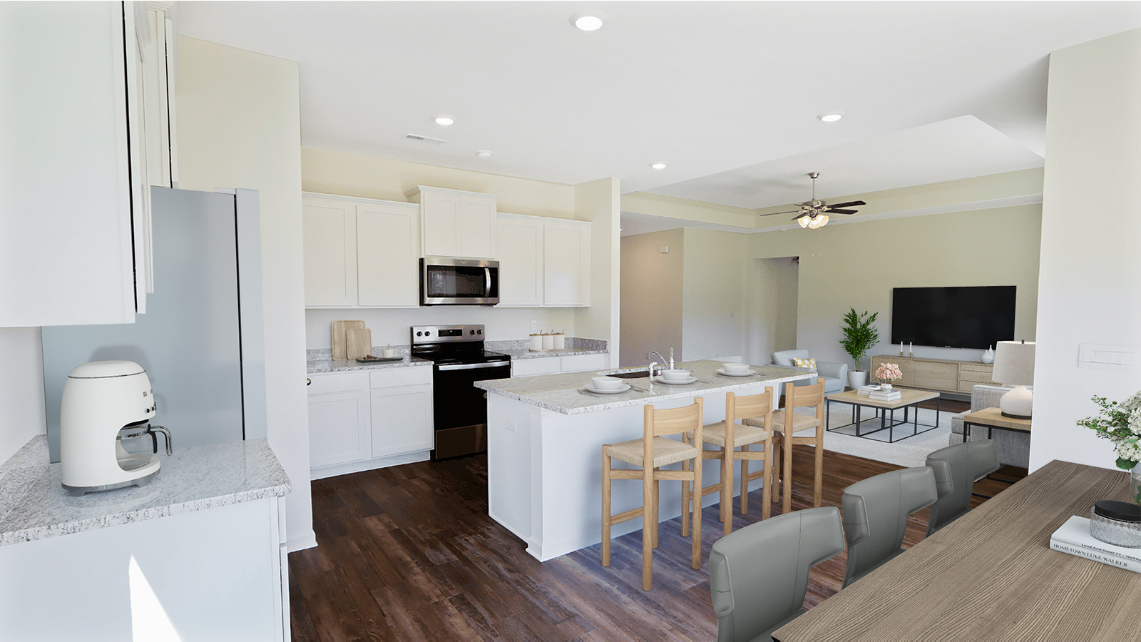 The dining room, kitchen, and living room all boast an open space with ample natural light.