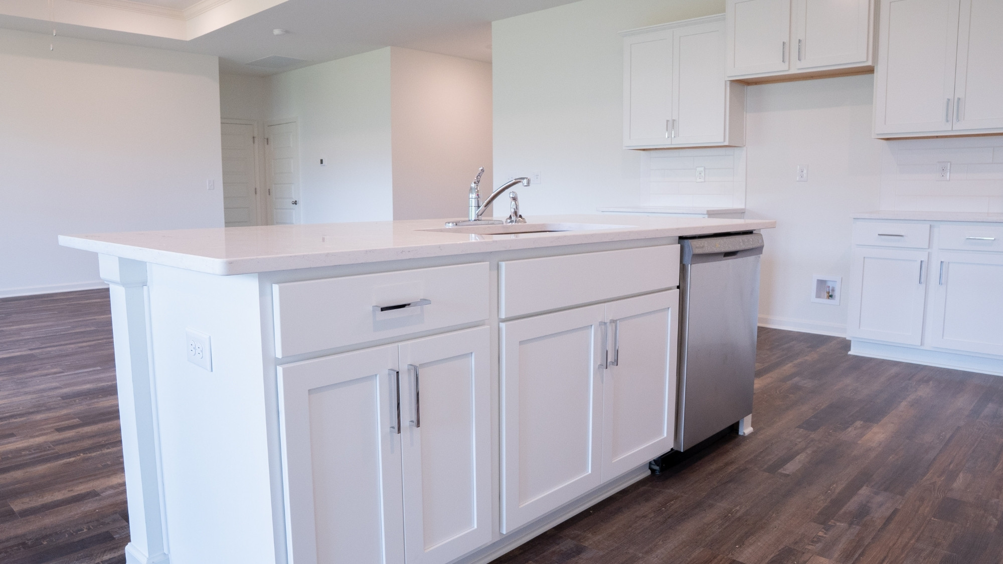 Refined en-suite bathroom featuring twin vanities, a spacious step-in shower, and a separate garden-style tub.