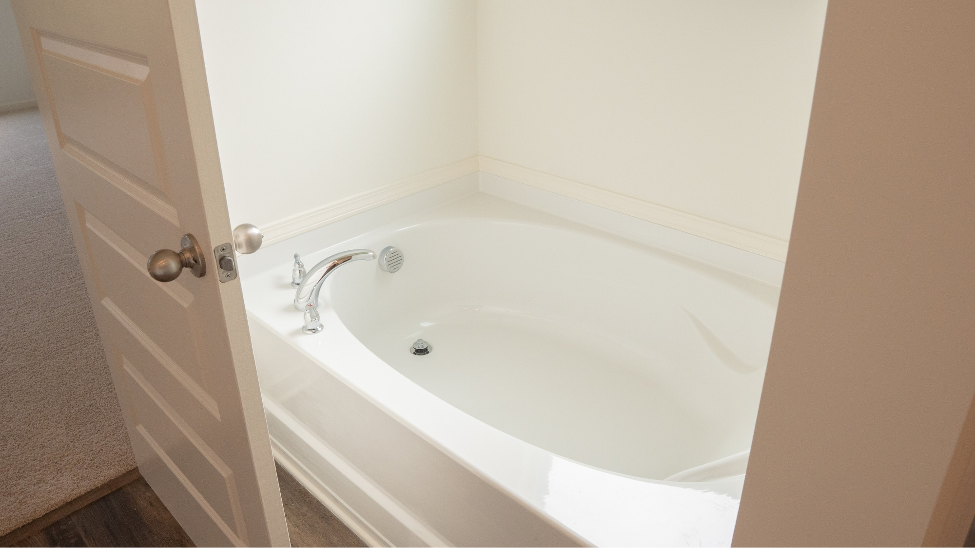 Modern primary bathroom with sleek finishes and a clean, minimalist layout.