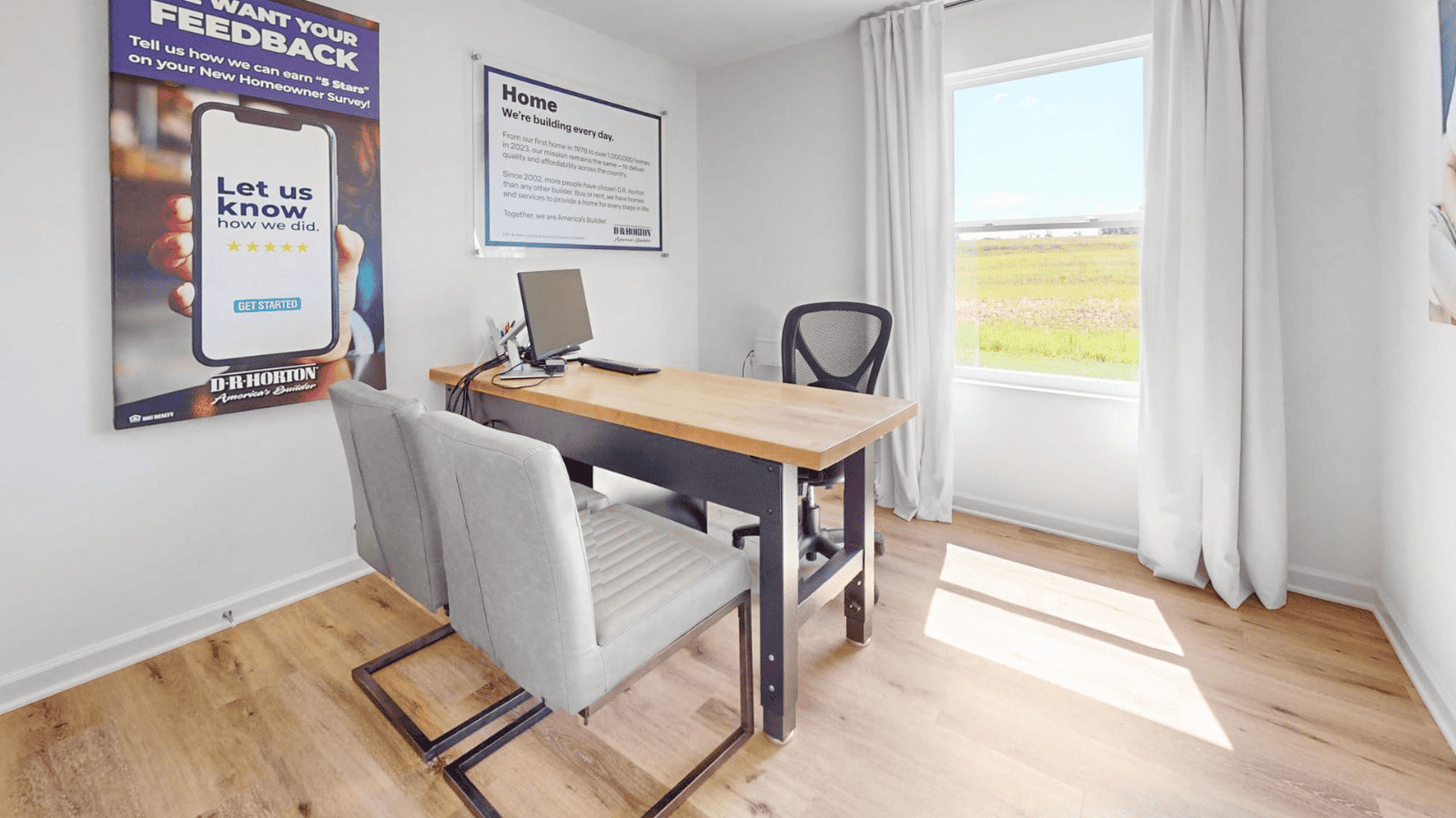 The second bedroom is currently being utilized as an office. It features an oversized desk with plenty of space remaining in the room.