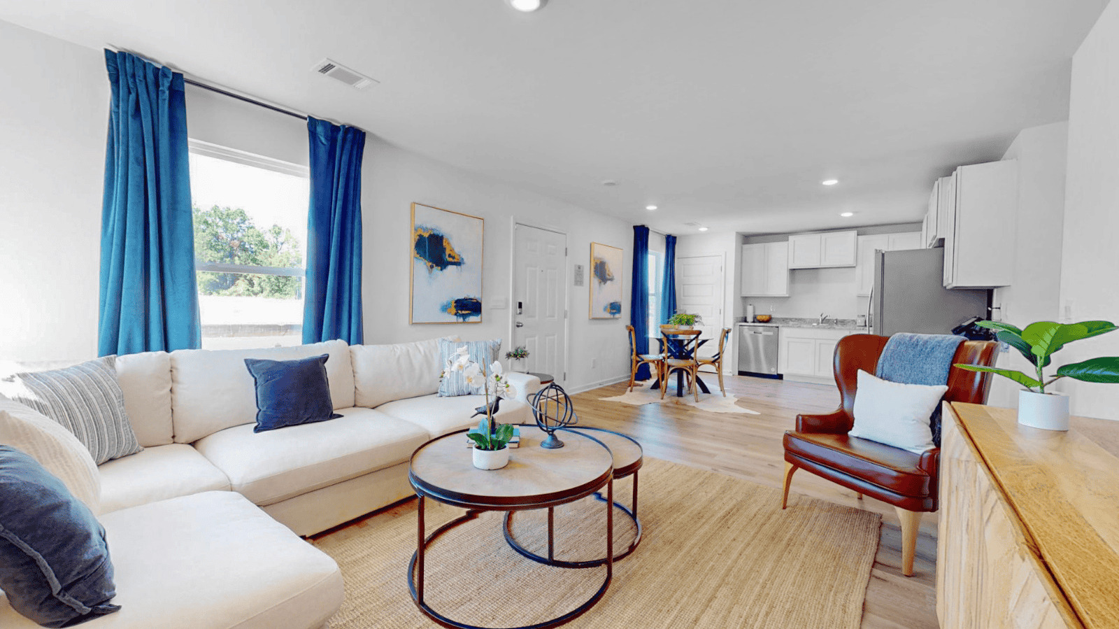 Bright and inviting living room with comfortable seating and stylish decor perfect for relaxation and entertainment.