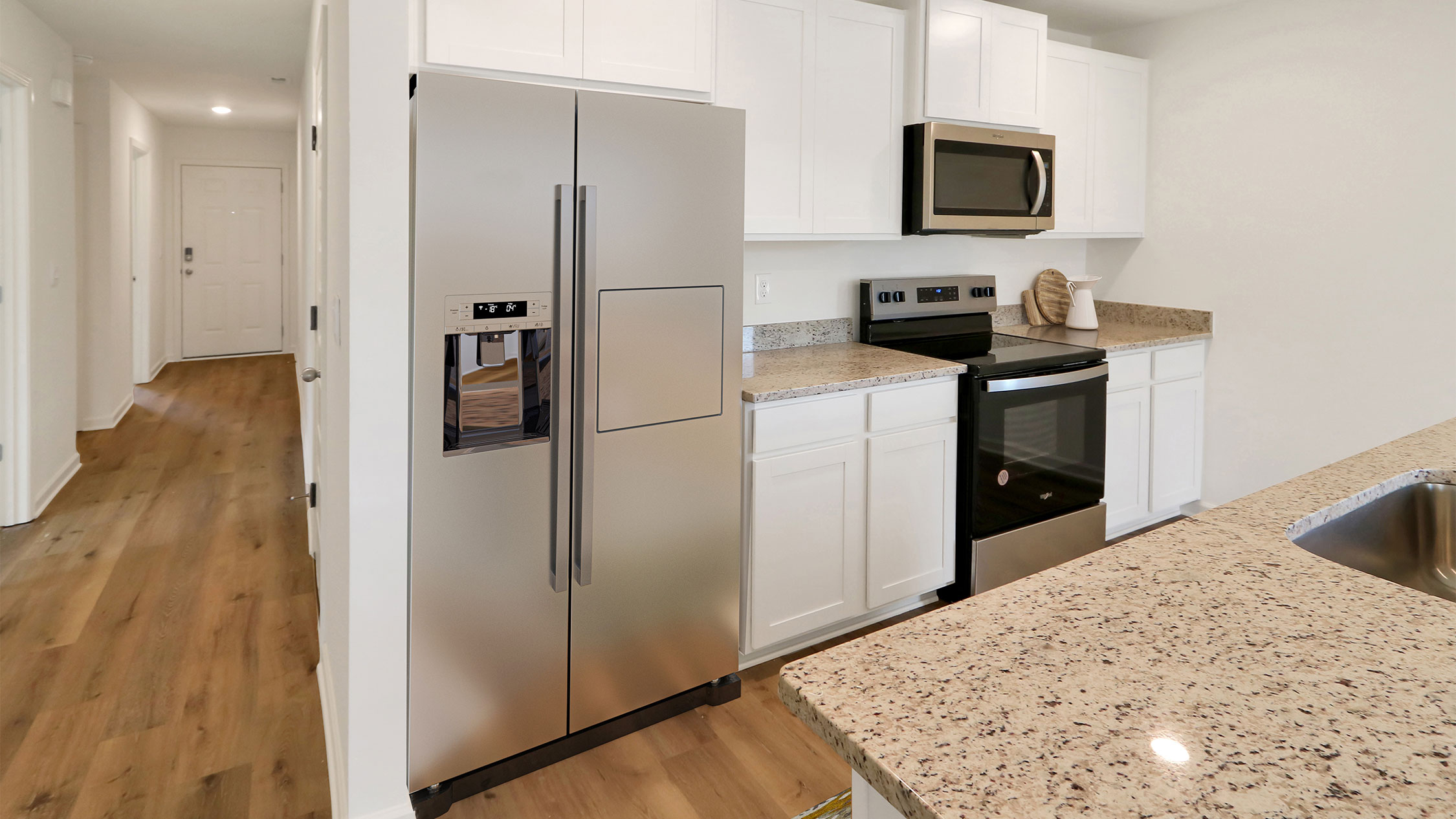 A modern kitchen featuring stainless steel appliances and a sleek granite countertop, showcasing contemporary design elements.   2. A stylish kitchen equipped with stainless steel appliances and a polished granite countertop, highlighting modern aesthetics.   3. A contemporary kitchen with stainless steel appliances and a beautiful granite countertop, emphasizing elegance and functionality.