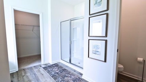 Destin – Primary Bathroom – 1 – the primary bathroom which is right off of the primary bedroom features a double vanity with 2 sinks, a walk in shower and the primary closet in the back