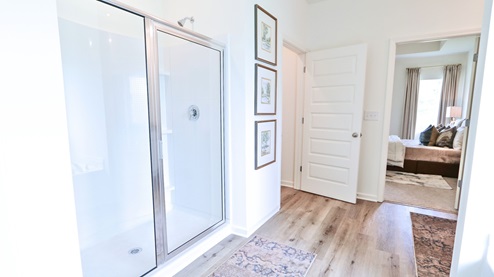 Destin – Primary Bathroom – 1 – the primary bathroom which is right off of the primary bedroom features a double vanity with 2 sinks, a walk in shower and the primary closet in the back