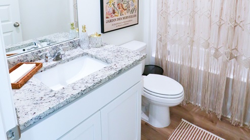 Destin – Primary Bathroom – 1 – the primary bathroom which is right off of the primary bedroom features a double vanity with 2 sinks, a walk in shower and the primary closet in the back