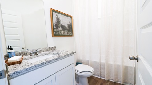 Destin – Primary Bathroom – 1 – the primary bathroom which is right off of the primary bedroom features a double vanity with 2 sinks, a walk in shower and the primary closet in the back
