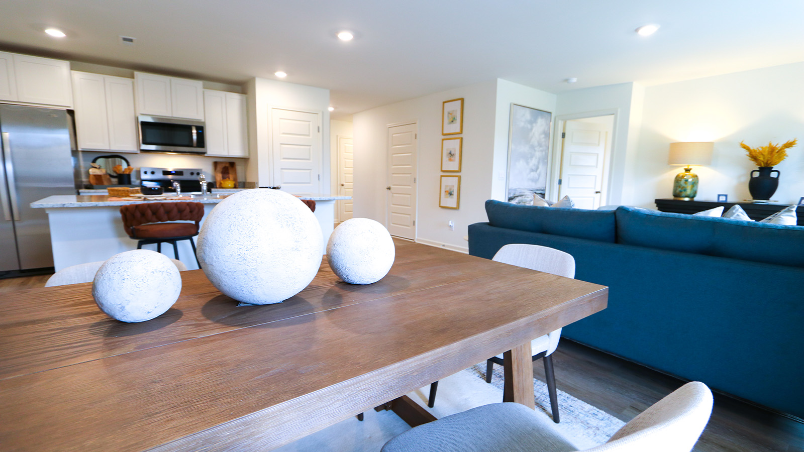 A spacious living room that opens to the dining room.