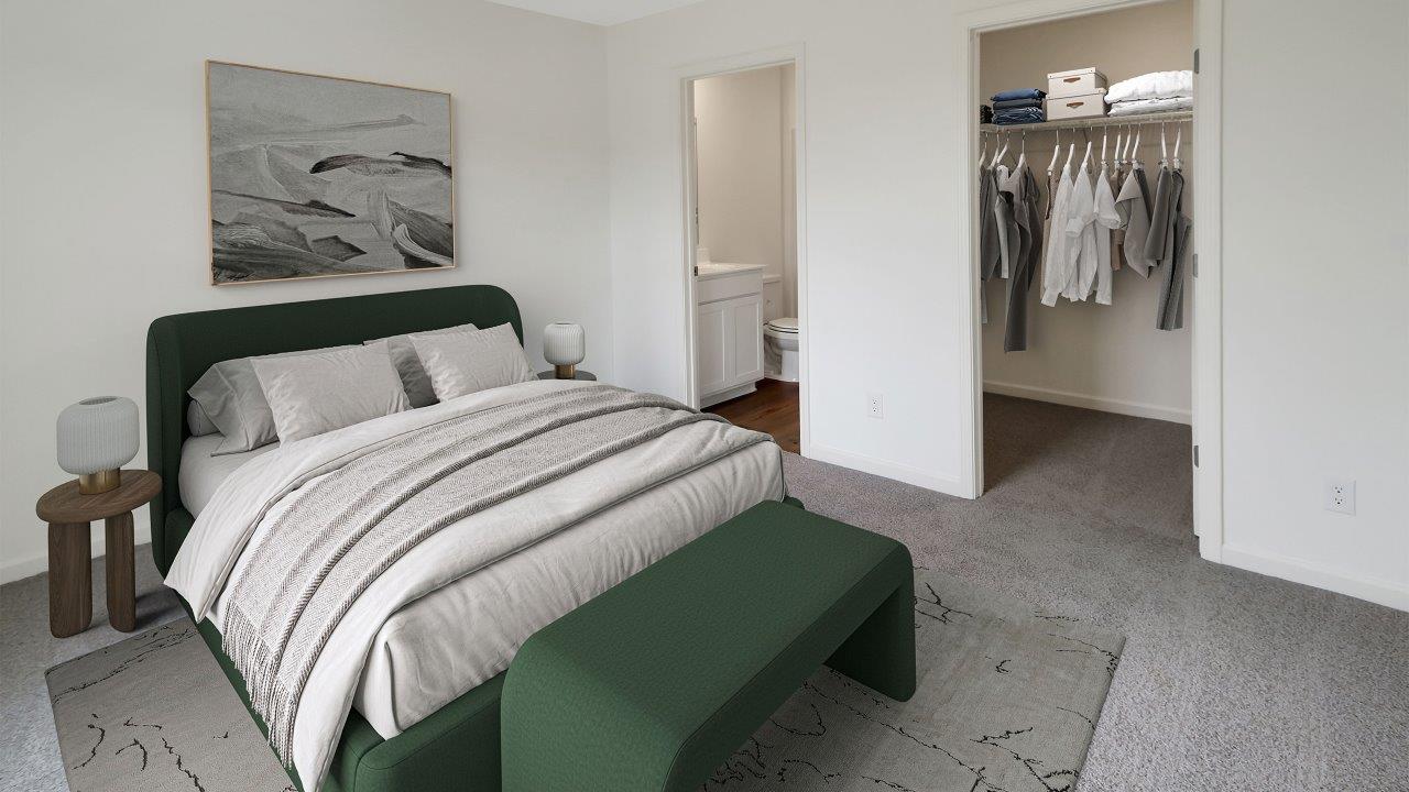 A serene bedroom featuring a green bed against crisp white walls, creating a fresh and inviting atmosphere.