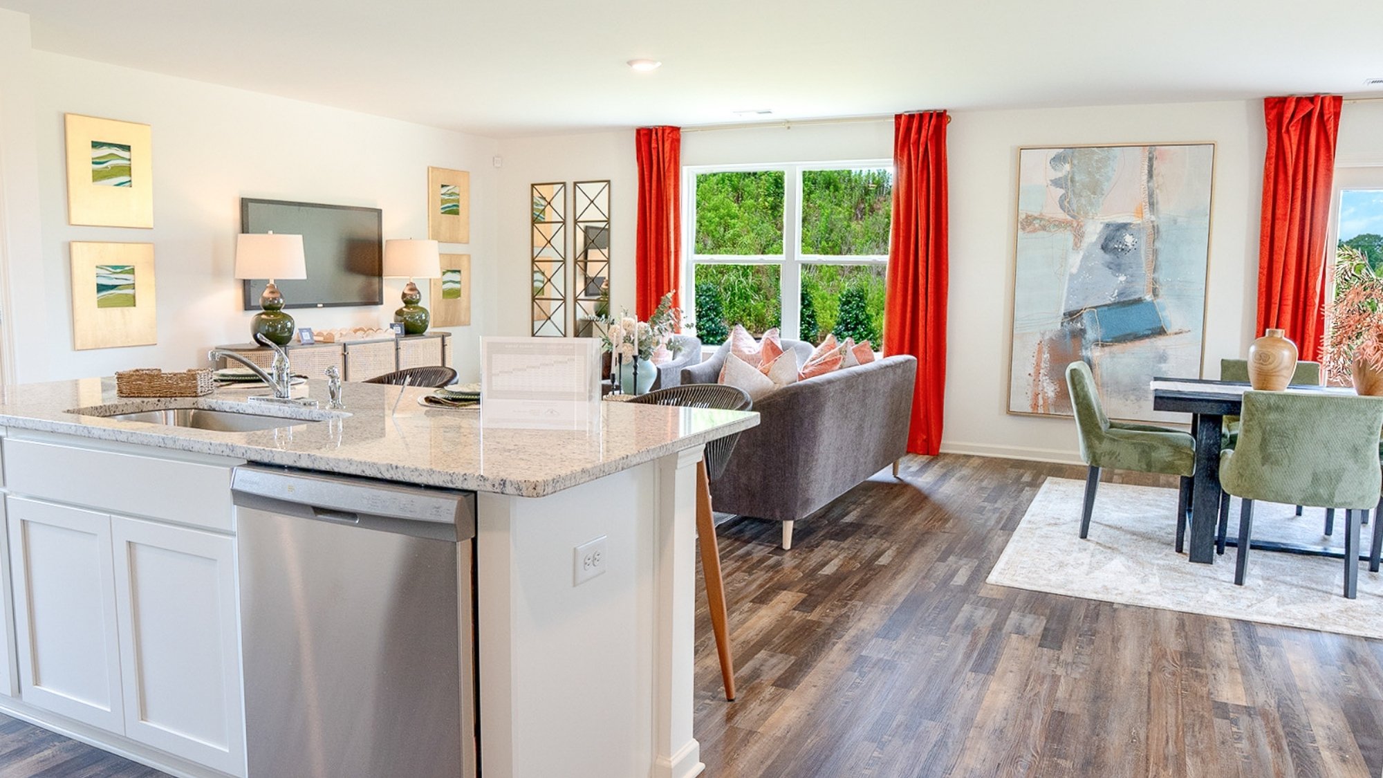 The roomy modern kitchen features stainless applianes and an island eating area large enough for 4 barstools.