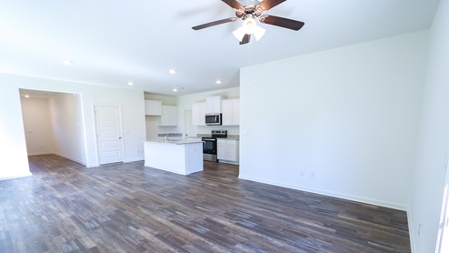 The open concept Robie floorplan has a spacious kitchen that opens into the dining and living room.