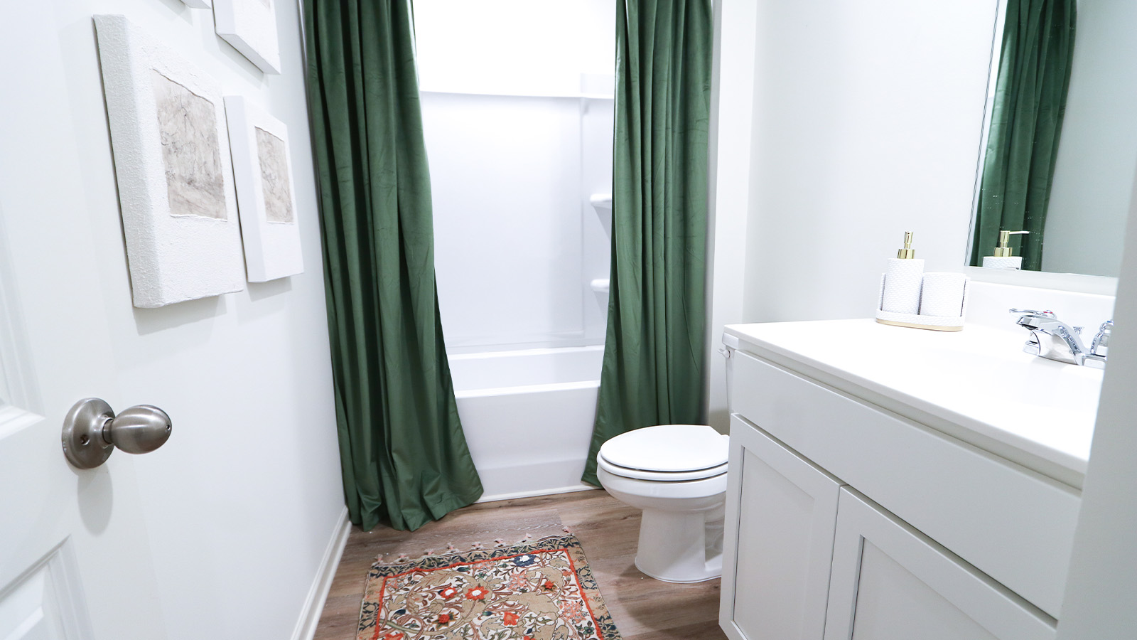 A spacious double vanity with mirrors is available. The vanity features ample space and two mirrors for convenience.