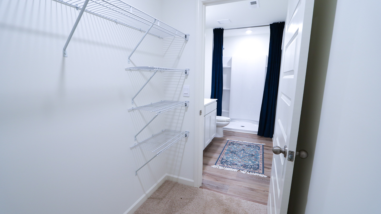 A spacious double vanity with mirrors is available. The vanity features ample space and two mirrors for convenience.