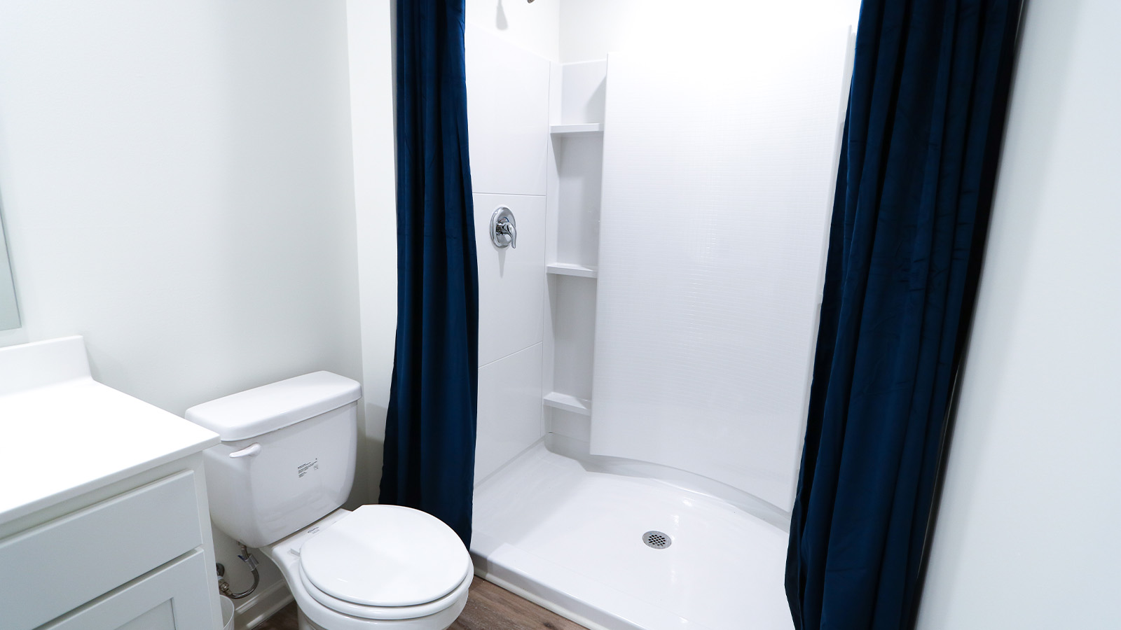 A spacious double vanity with mirrors is available. The vanity features ample space and two mirrors for convenience.