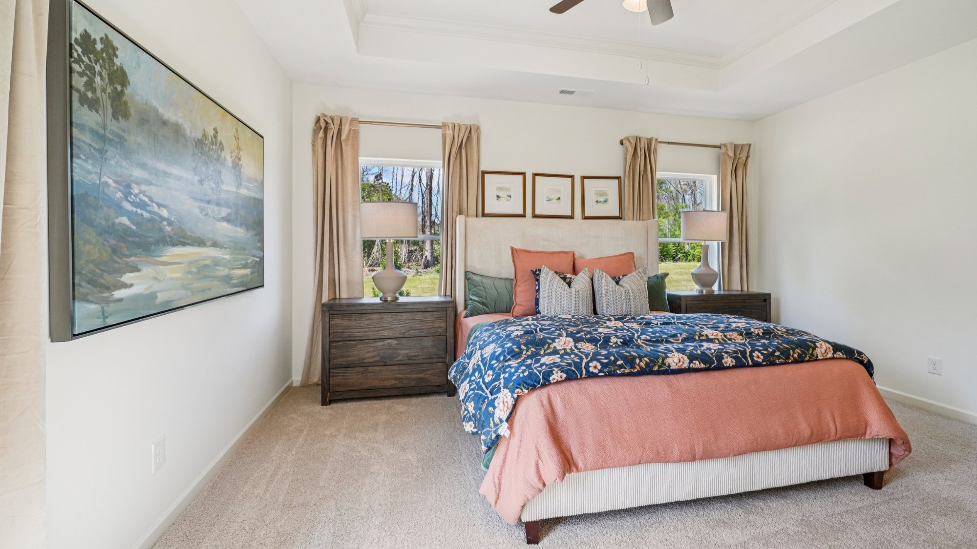 The spacious primary bedroom features a large king bed and two nightstands. Additionally, there is a sizable double window offering a view of the backyard.   The large primary bedroom shows off ample space with a large king bed, 2 nightstands and a large double window that overlooks the backyard.